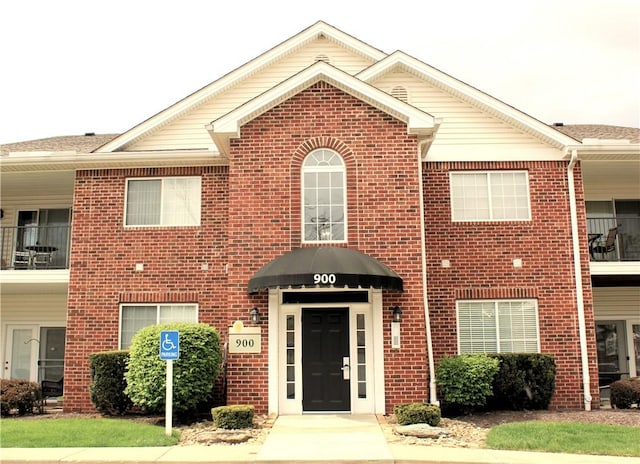 view of front of house with brick siding