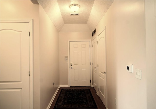 900 Hidden Ridge Ct Unit 202, South Park, PA 15129 - entryway with a textured ceiling, dark wood-style floors, and baseboards