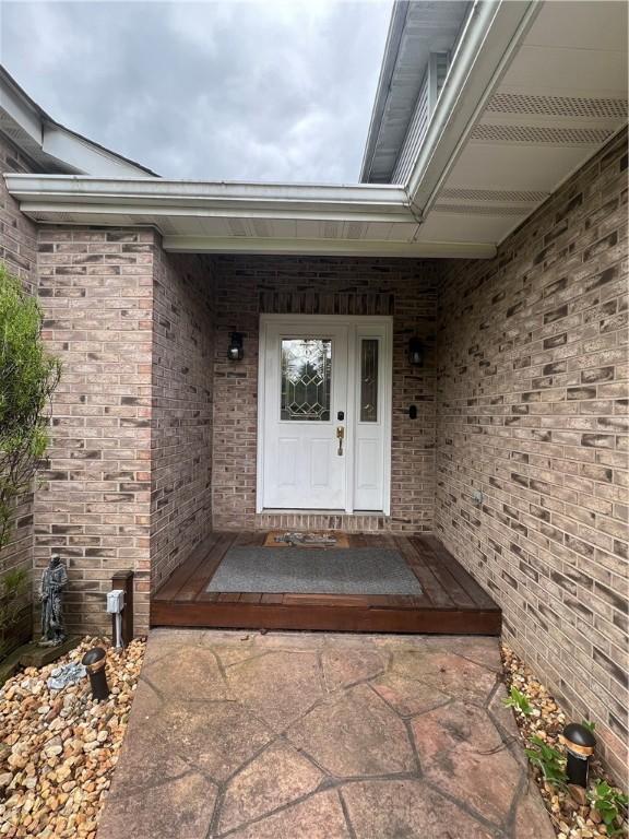 200 Holyoke Rd, Center Twp But, PA 16001 - property entrance featuring a porch and brick siding