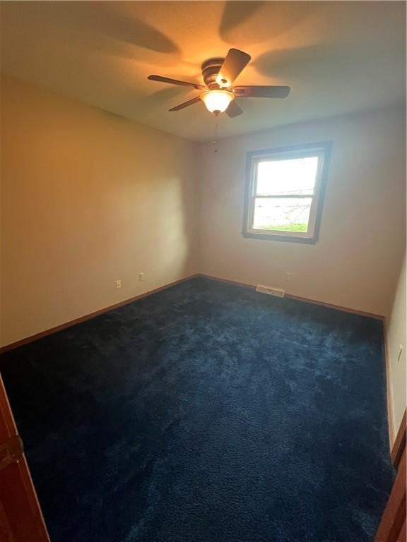 200 Holyoke Rd, Center Twp But, PA 16001 - unfurnished room featuring baseboards, ceiling fan, dark colored carpet, and visible vents