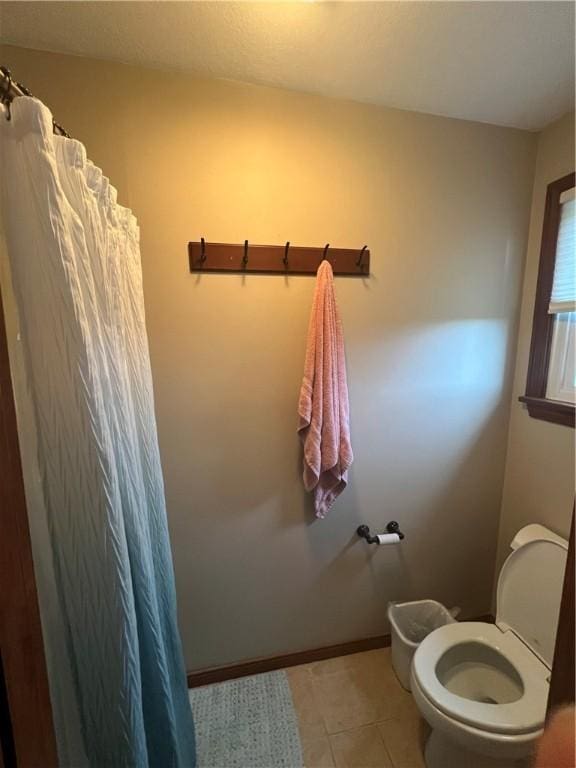 200 Holyoke Rd, Center Twp But, PA 16001 - bathroom featuring curtained shower, toilet, baseboards, and tile patterned floors