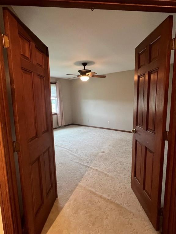 200 Holyoke Rd, Center Twp But, PA 16001 - unfurnished room featuring a ceiling fan, light carpet, and baseboards