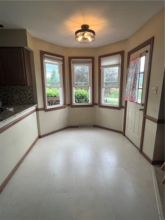 200 Holyoke Rd, Center Twp But, PA 16001 - unfurnished dining area with light floors, baseboards, and visible vents