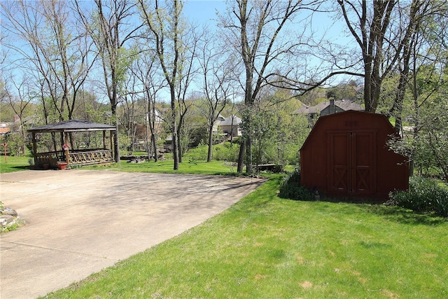 view of yard with a storage unit, a gazebo, and an outdoor structure