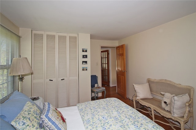 bedroom with a closet and wood finished floors