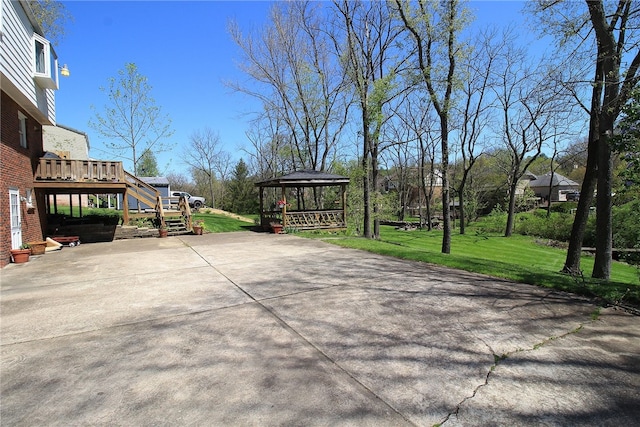 view of patio featuring stairway, a gazebo, and a deck