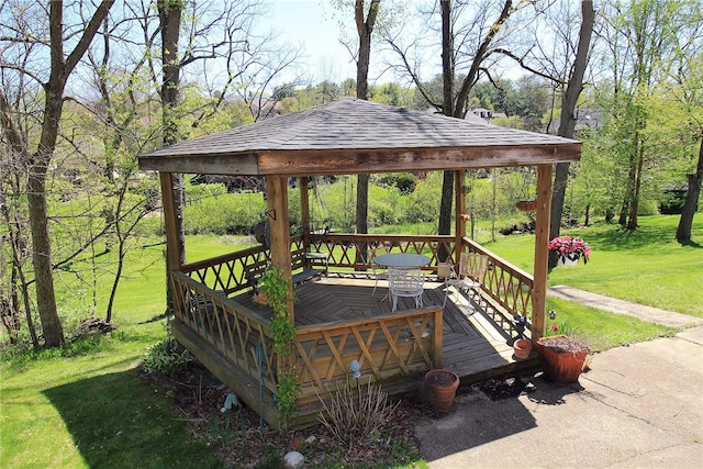 deck with a gazebo and a lawn