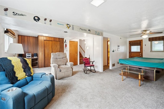 interior space featuring light colored carpet, billiards, and ceiling fan