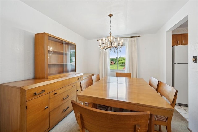 dining space with light carpet and a notable chandelier