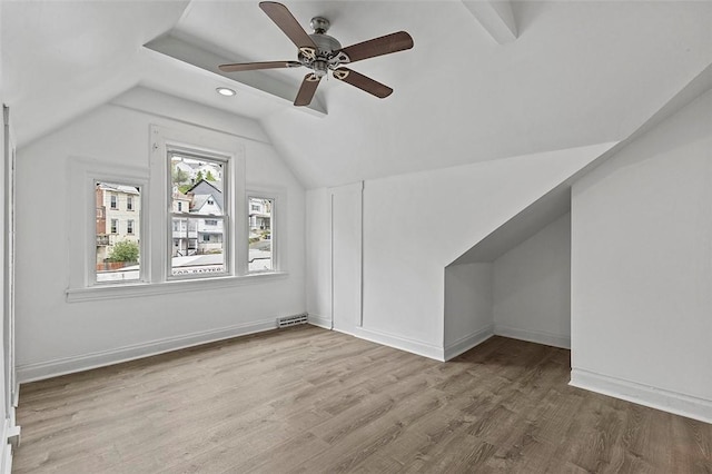 bonus room with wood finished floors, visible vents, baseboards, ceiling fan, and lofted ceiling