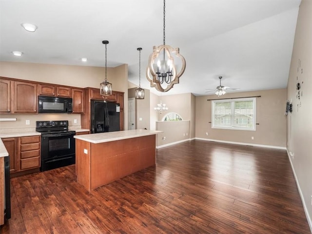 105 Luzerne Ave, South Union Twp, PA 15401 - kitchen featuring a center island, ceiling fan with notable chandelier, vaulted ceiling, black appliances, and light countertops