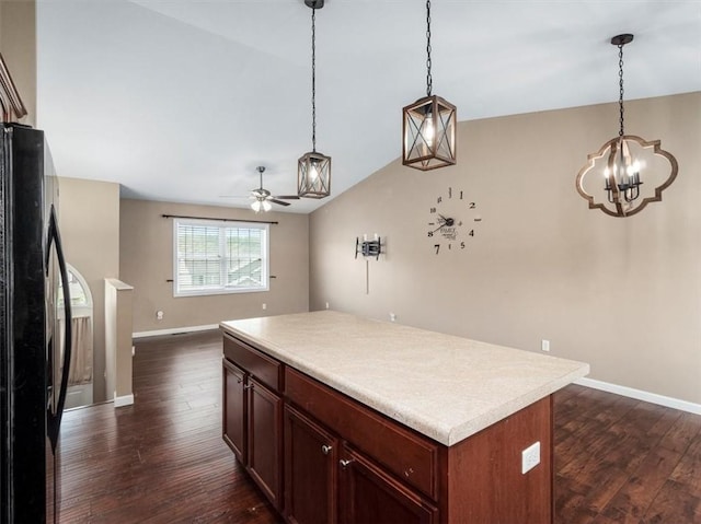 105 Luzerne Ave, South Union Twp, PA 15401 - kitchen featuring freestanding refrigerator, ceiling fan with notable chandelier, open floor plan, light countertops, and dark wood-style floors