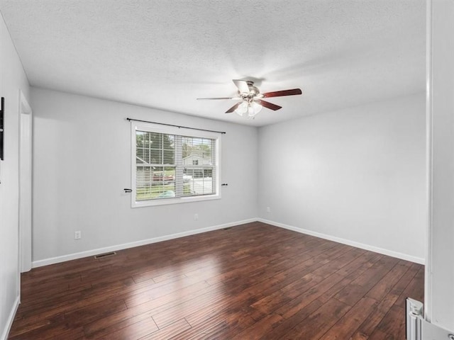 105 Luzerne Ave, South Union Twp, PA 15401 - spare room featuring a ceiling fan, a textured ceiling, visible vents, baseboards, and dark wood-style flooring