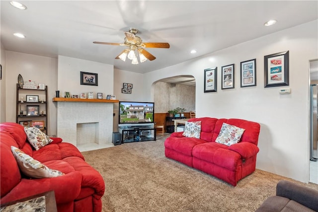 73 Hempstead Ave, West View, PA 15229 - carpeted living area with a fireplace, a ceiling fan, arched walkways, and recessed lighting