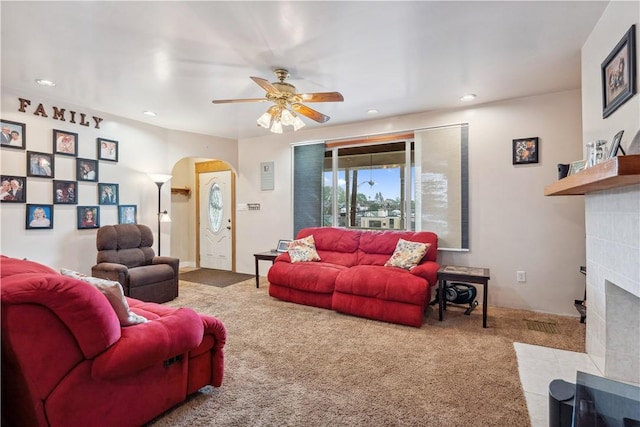 73 Hempstead Ave, West View, PA 15229 - carpeted living area featuring ceiling fan, a tile fireplace, arched walkways, and recessed lighting
