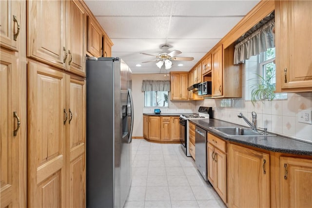 73 Hempstead Ave, West View, PA 15229 - kitchen with a sink, light tile patterned flooring, backsplash, dark countertops, and appliances with stainless steel finishes