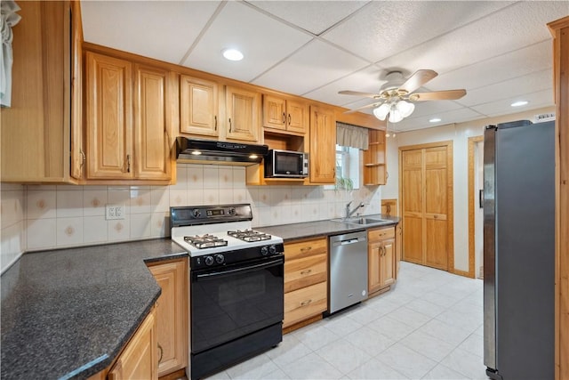 73 Hempstead Ave, West View, PA 15229 - kitchen with a sink, stainless steel appliances, under cabinet range hood, decorative backsplash, and a ceiling fan