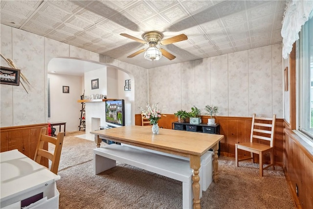 73 Hempstead Ave, West View, PA 15229 - dining area featuring carpet flooring, wallpapered walls, ceiling fan, and arched walkways