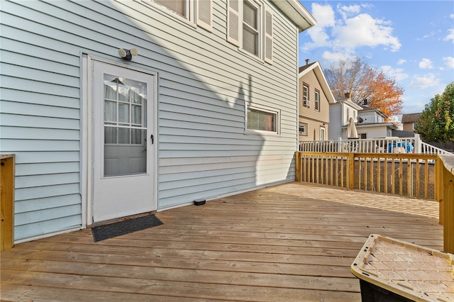 wooden terrace with a residential view