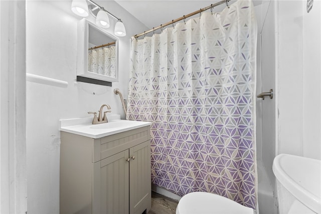bathroom featuring toilet, vanity, and shower / tub combo with curtain