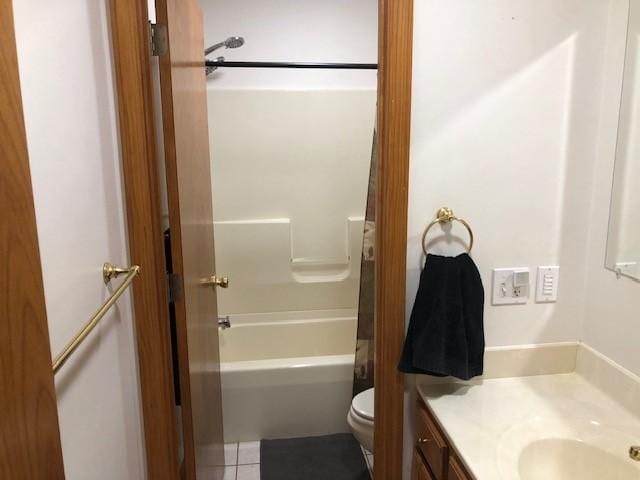 bathroom featuring shower / bath combination, vanity, toilet, and tile patterned floors