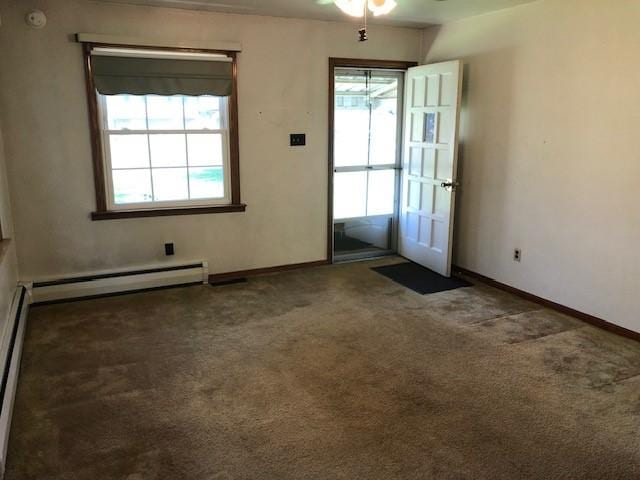 doorway to outside featuring baseboards, a baseboard radiator, ceiling fan, and carpet floors