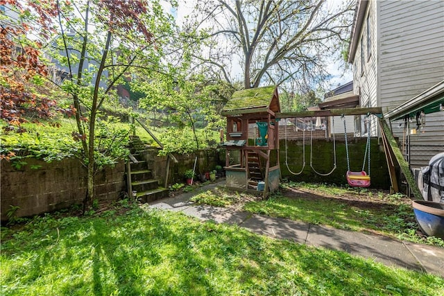 view of yard with a playground and fence