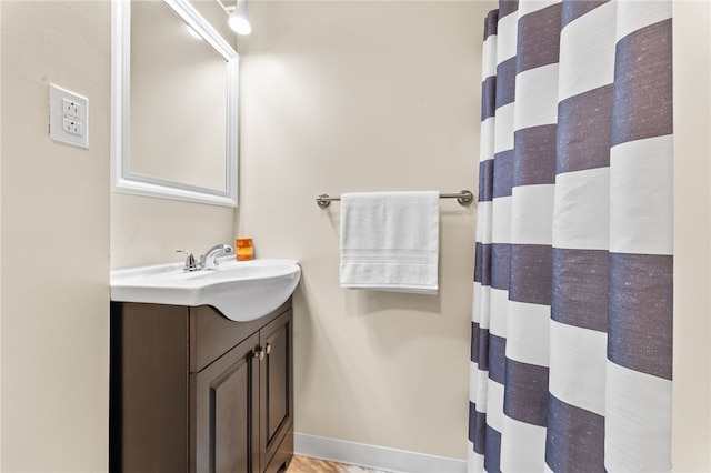 bathroom with vanity and curtained shower
