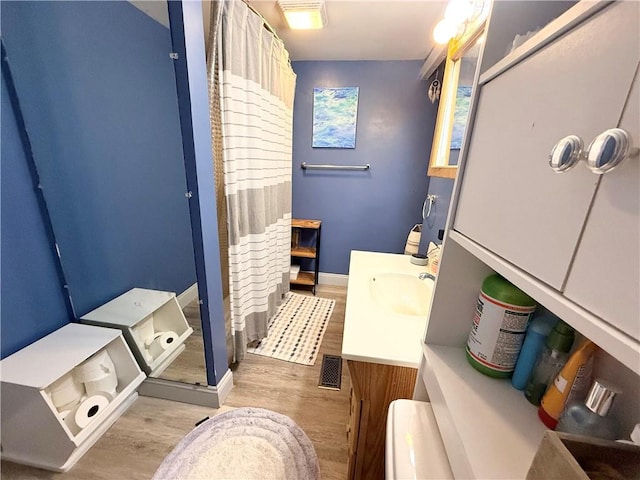 1415 E Washington St, New Castle/4Th, PA 16101 - bathroom featuring a stall shower, baseboards, visible vents, vanity, and wood finished floors