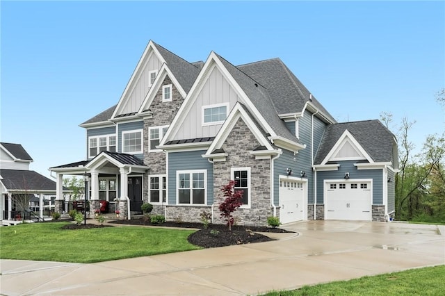 craftsman-style house featuring stone siding, driveway, board and batten siding, a front lawn, and roof with shingles