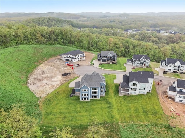 aerial view featuring a view of trees