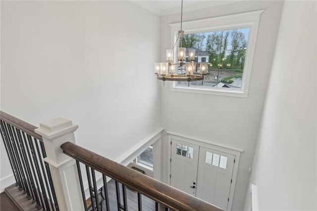 foyer with a chandelier and a high ceiling
