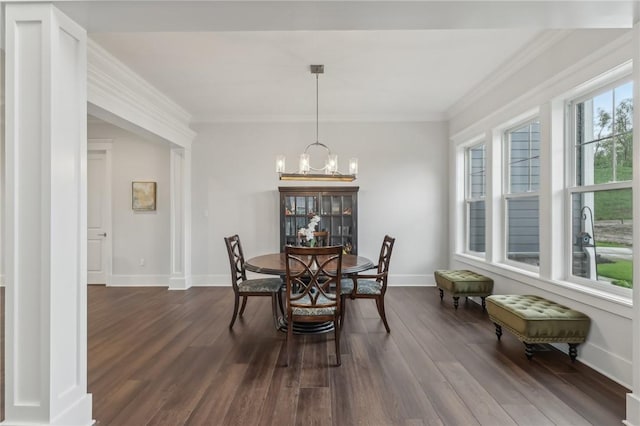dining room with baseboards, ornamental molding, a chandelier, and dark wood-style floors