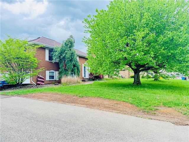 view of front of home with brick siding
