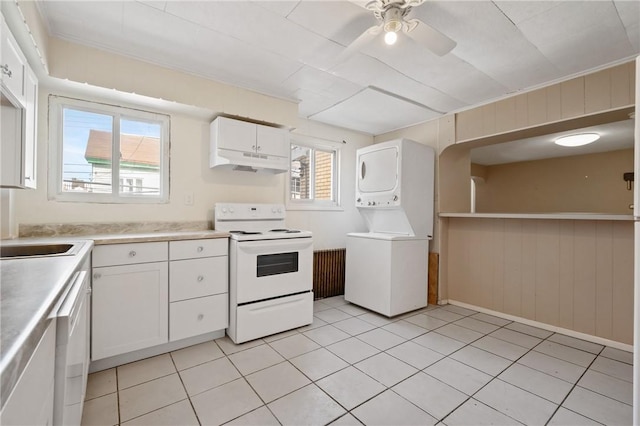 kitchen with stacked washer and clothes dryer, white cabinetry, ceiling fan, white appliances, and under cabinet range hood
