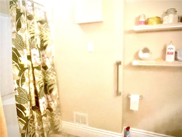 full bathroom with a shower with shower curtain