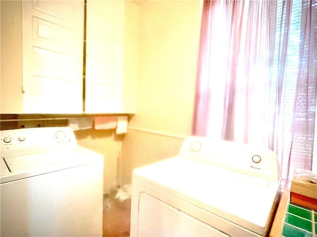 laundry room with washer and clothes dryer and laundry area