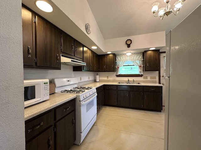 861 Chicora Rd, Oakland Twp, PA 16025 - kitchen featuring a sink, white appliances, under cabinet range hood, light countertops, and dark brown cabinets
