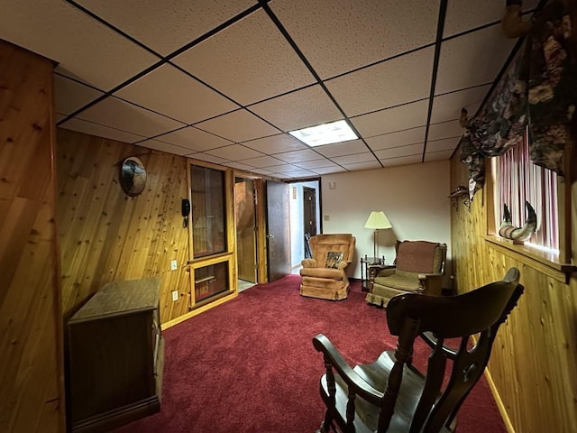 861 Chicora Rd, Oakland Twp, PA 16025 - living area with a paneled ceiling, wood walls, and carpet floors