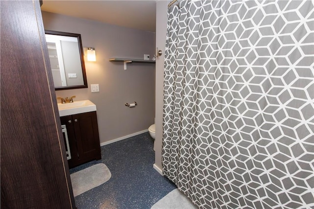 761 Dawson St, California, PA 15419 - full bathroom featuring vanity, baseboards, toilet, and a tile shower