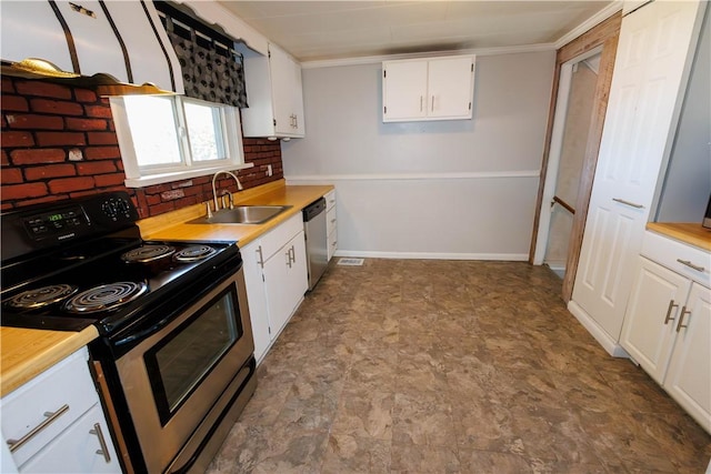 761 Dawson St, California, PA 15419 - kitchen featuring a sink, white cabinetry, light countertops, and appliances with stainless steel finishes