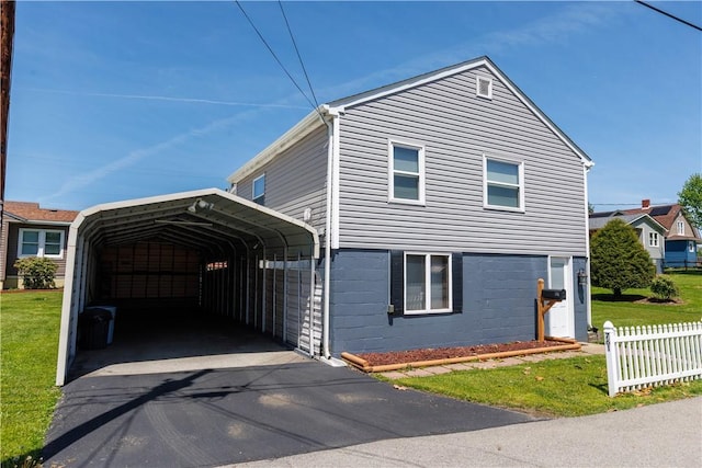 761 Dawson St, California, PA 15419 - traditional-style house with a detached carport, driveway, fence, and a front lawn