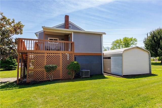 761 Dawson St, California, PA 15419 - rear view of property featuring a storage shed, an outdoor structure, a deck, a yard, and cooling unit