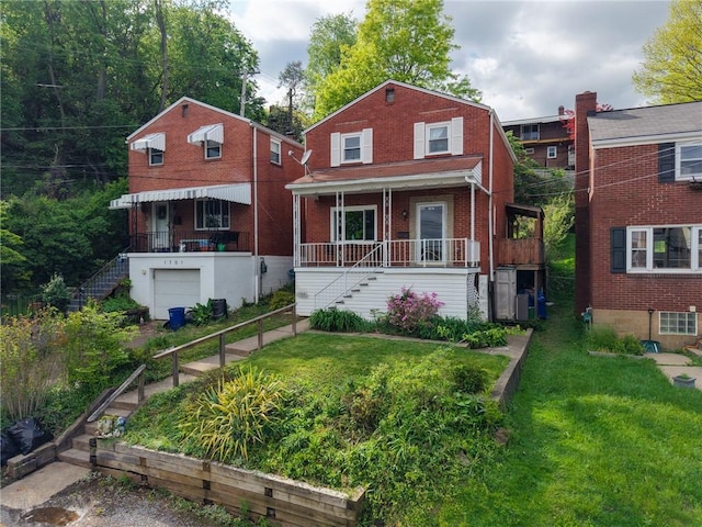view of front of property with covered porch, stairs, a front lawn, and brick siding