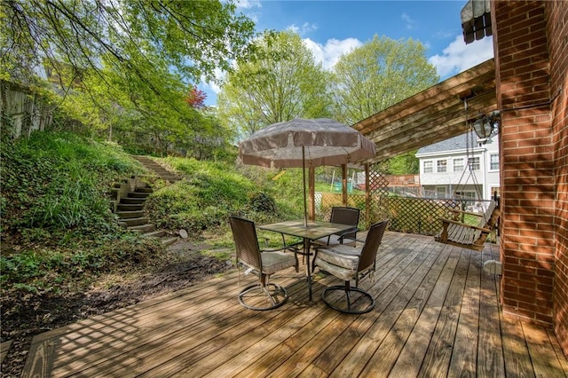 wooden deck with stairs and outdoor dining area