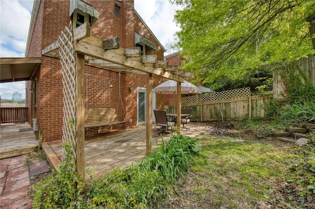 deck with fence and outdoor dining space