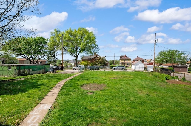 view of yard with fence and a residential view