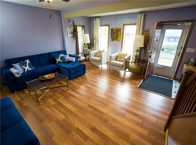 6518 Adelphia St, Stanton Heights, PA 15206 - living area featuring a textured ceiling, a ceiling fan, and wood finished floors