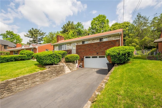 1306 Cochran Rd, Mt Lebanon, PA 15243 - view of front of home featuring a garage, driveway, a chimney, and a front yard