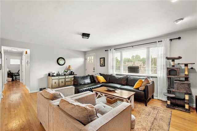 1306 Cochran Rd, Mt Lebanon, PA 15243 - living room featuring light wood-style flooring and baseboards